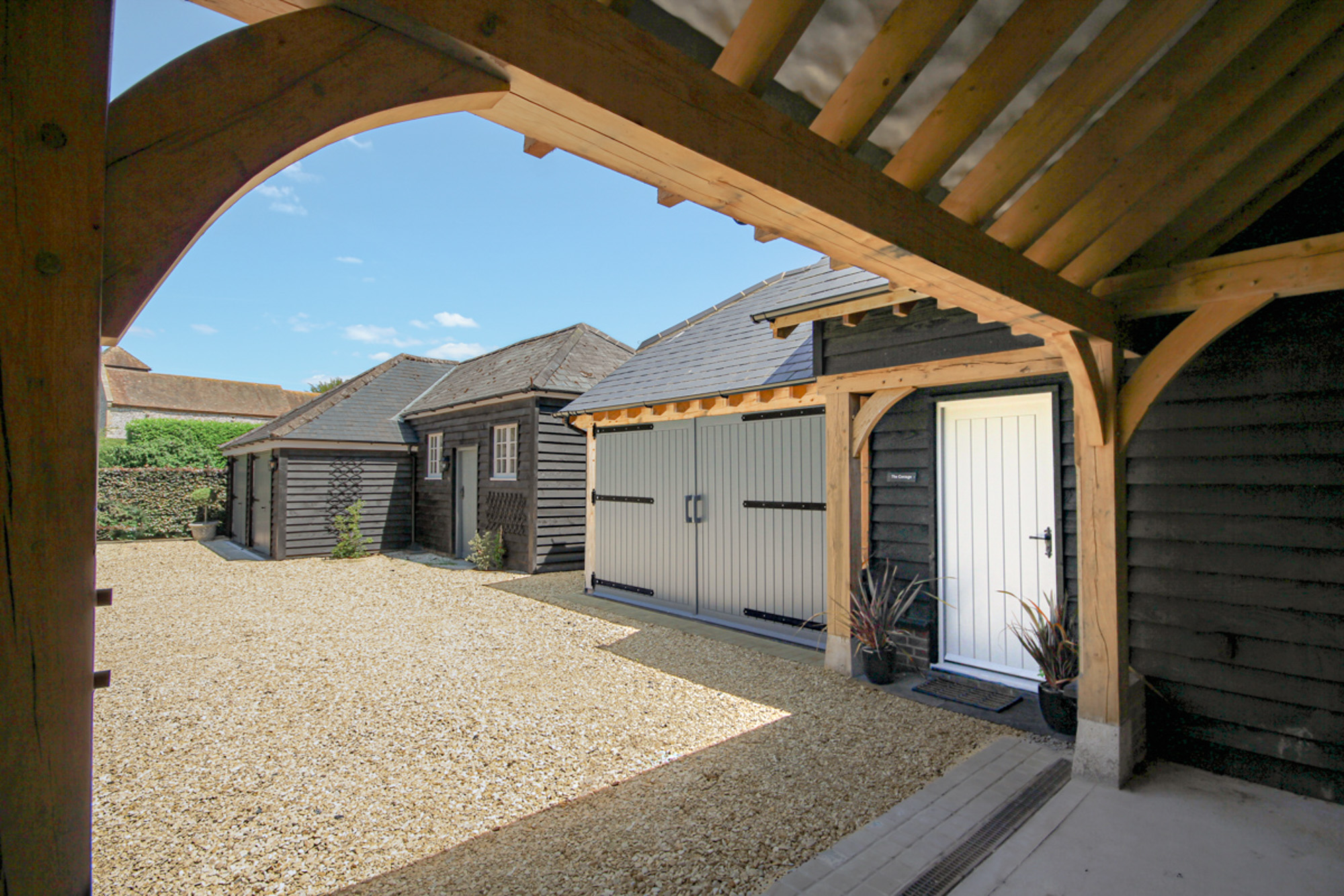 View of Garage Doors From Within The Carport